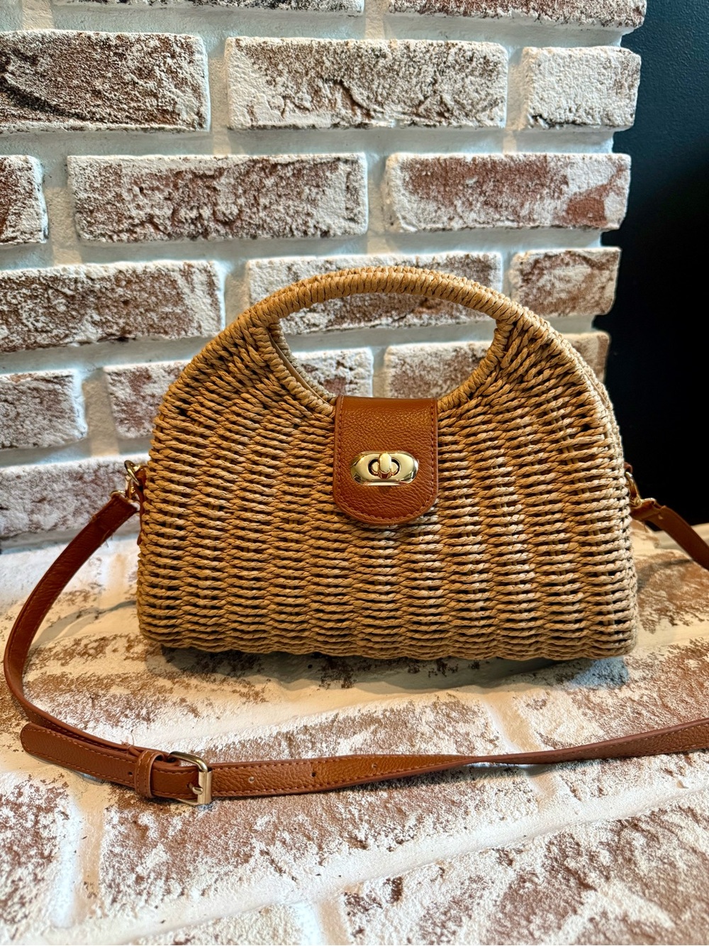 Woven Straw Adjustable Crossbody Bag with Tan Leather Trim and Turnlock Closure